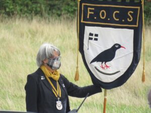 Representing Federation of Old Cornwall Societies, President Karin Easton President of the Federation with the Federation Banner